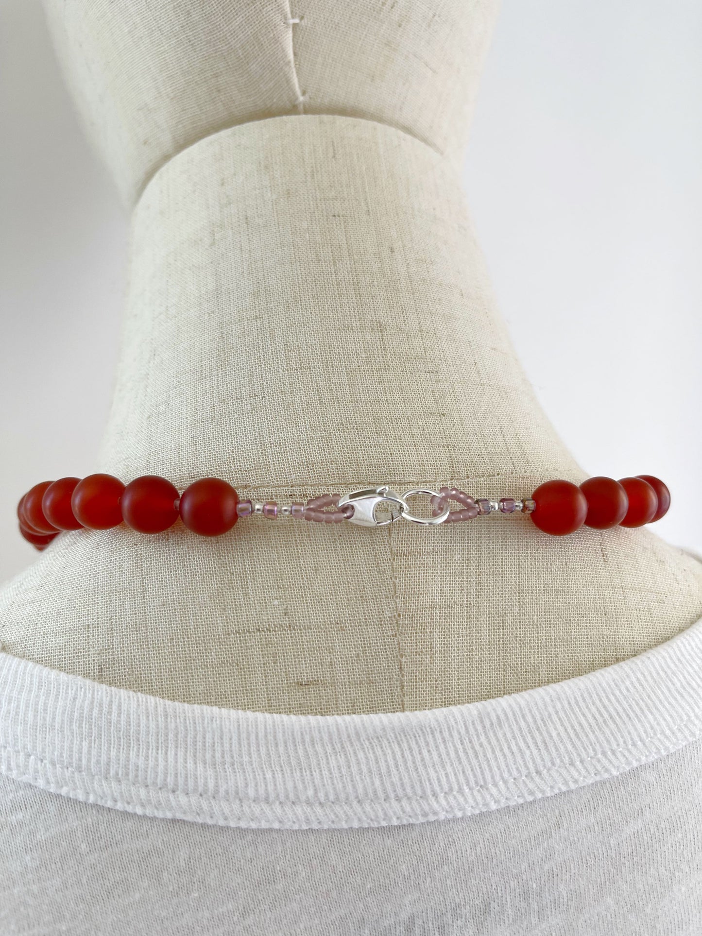 BD. Necklace of Carnelian with a matte finish and sterling silver lobster claw clasp 18”