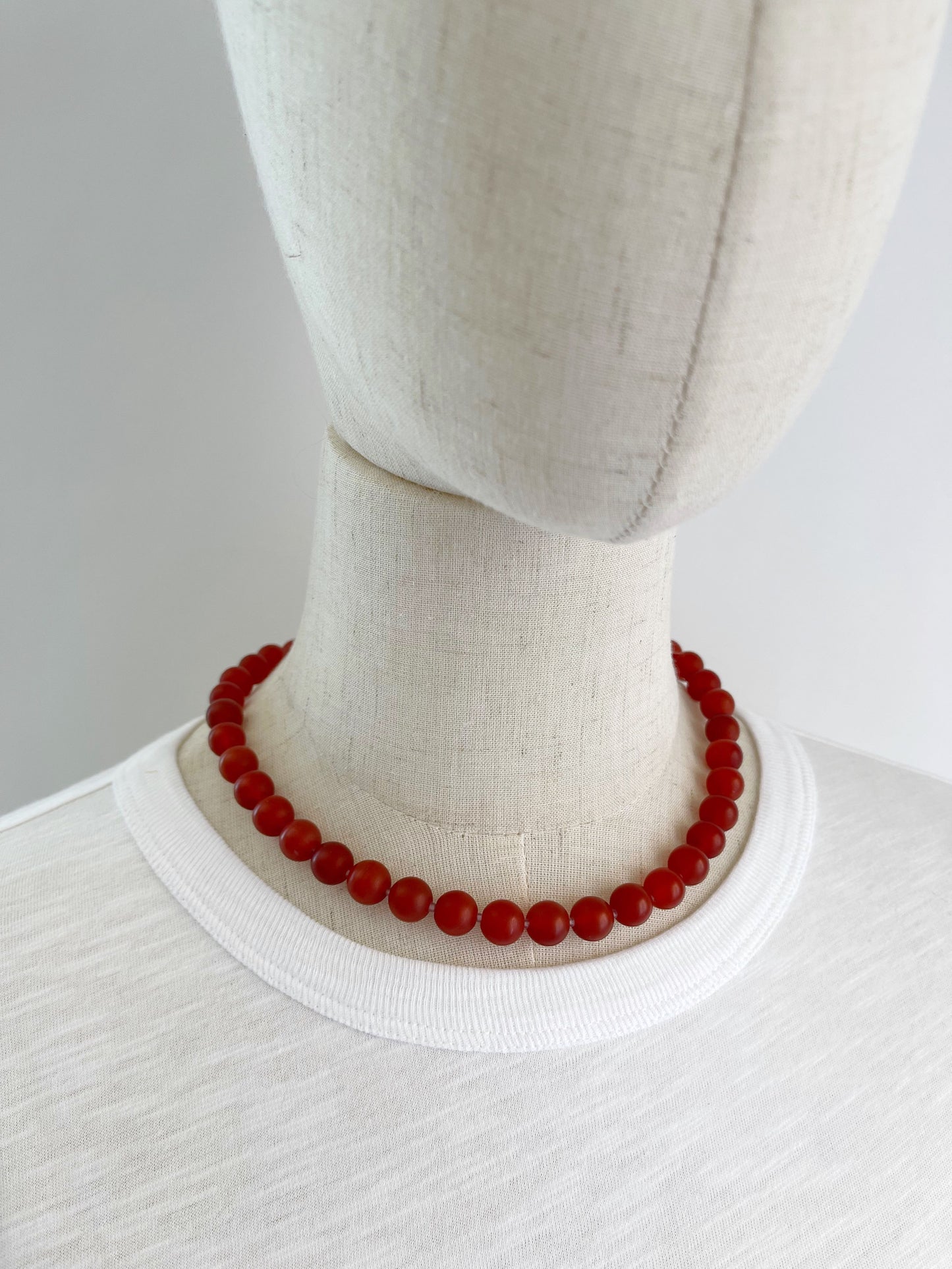 BD. Necklace of Carnelian with a matte finish and sterling silver lobster claw clasp 18”