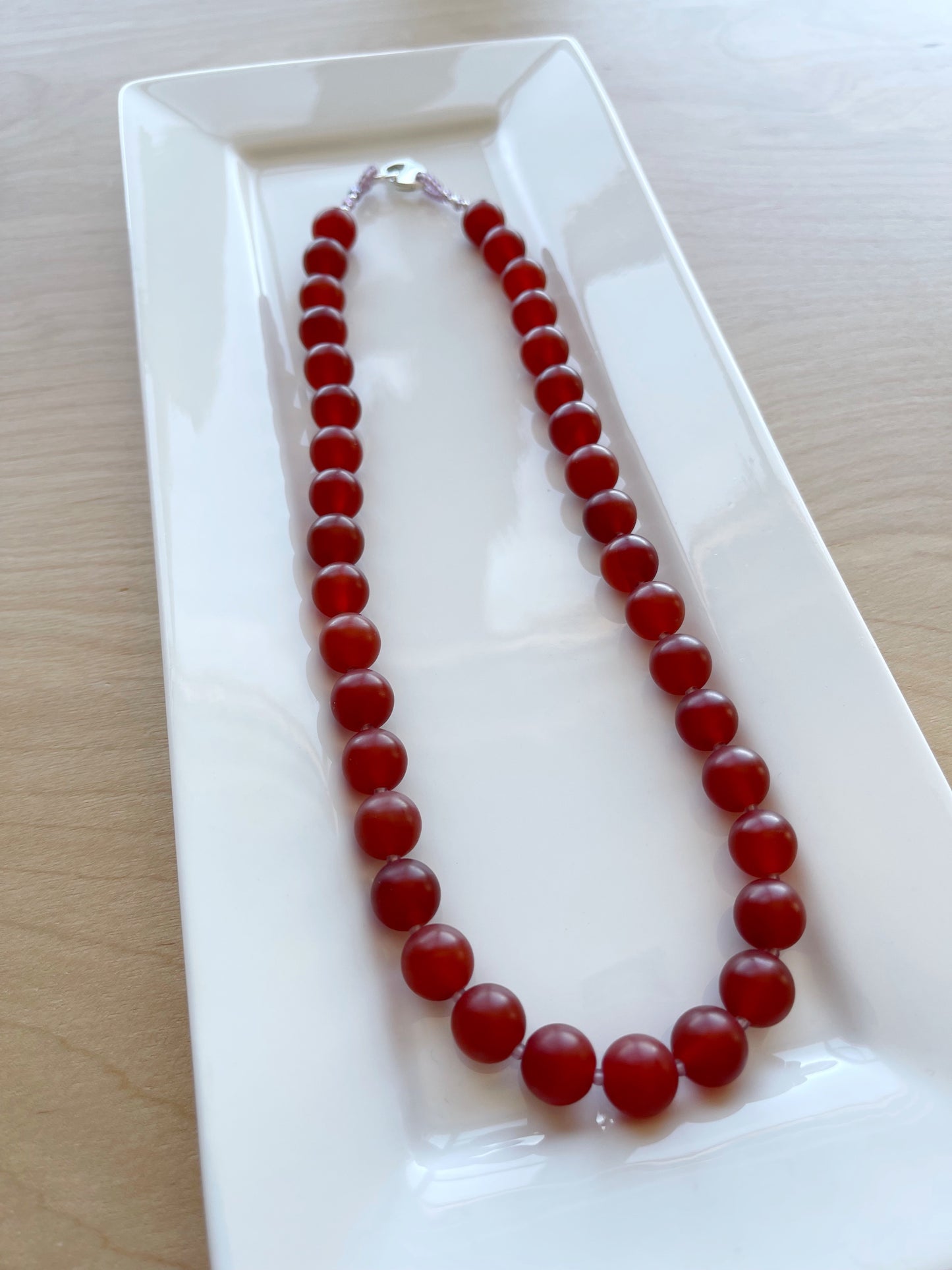 BD. Necklace of Carnelian with a matte finish and sterling silver lobster claw clasp 18”