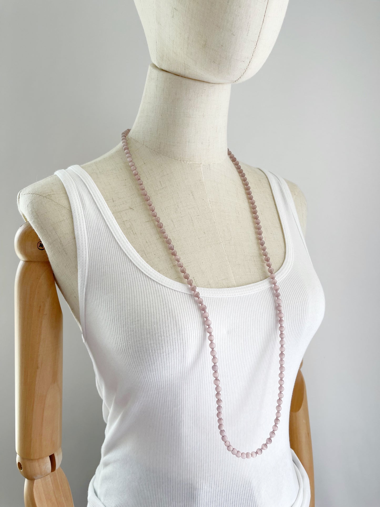 B. 38” Long & double-able necklace of Mauve Cat’s Eye Glass