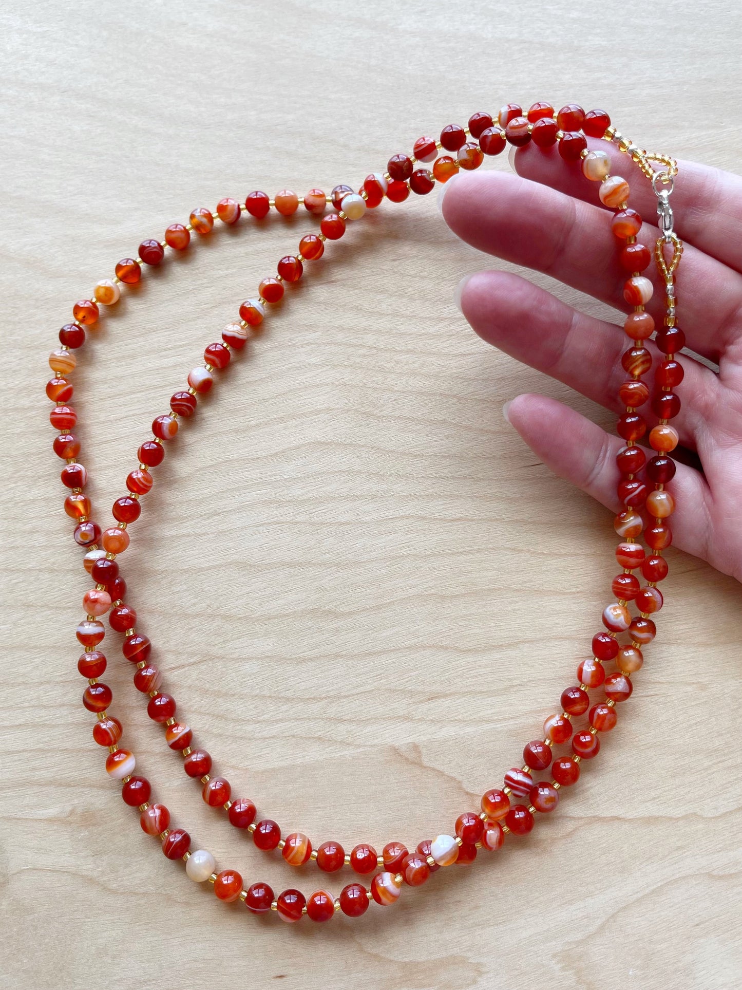 B. 38” Long & double-able necklace of Red Striped Agate