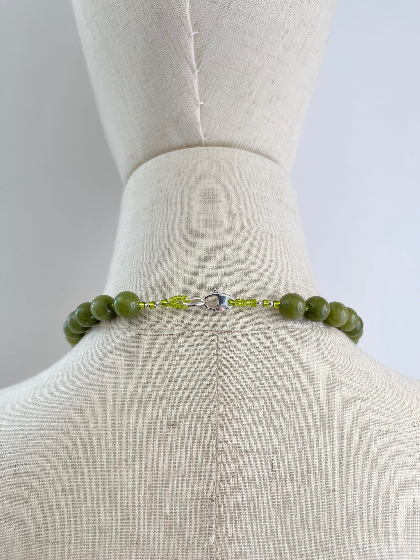 C. Necklace of Chinese Jade with a sterling silver lobster claw clasp