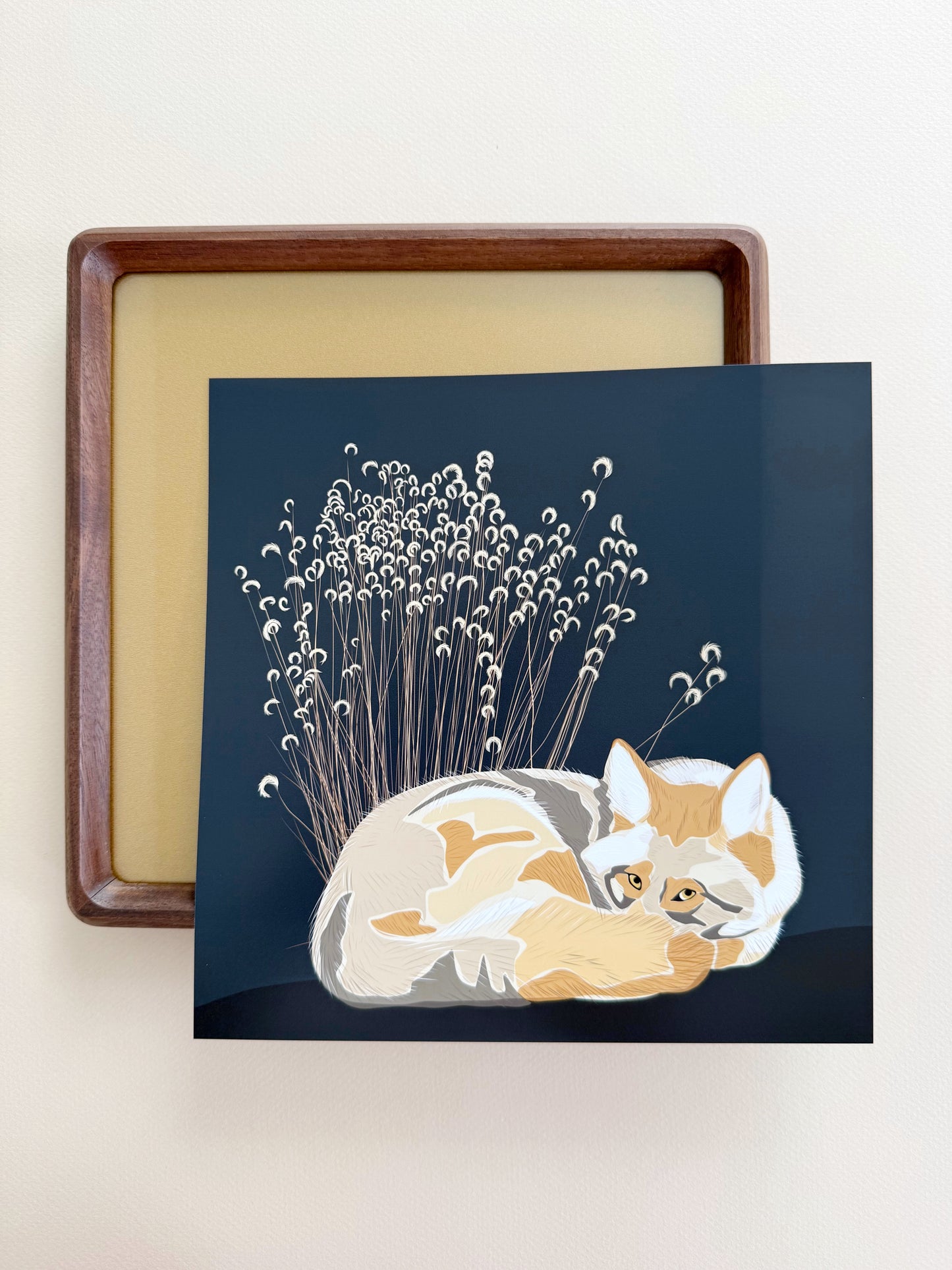 AG. Coyote with grasses print on an espresso brown background