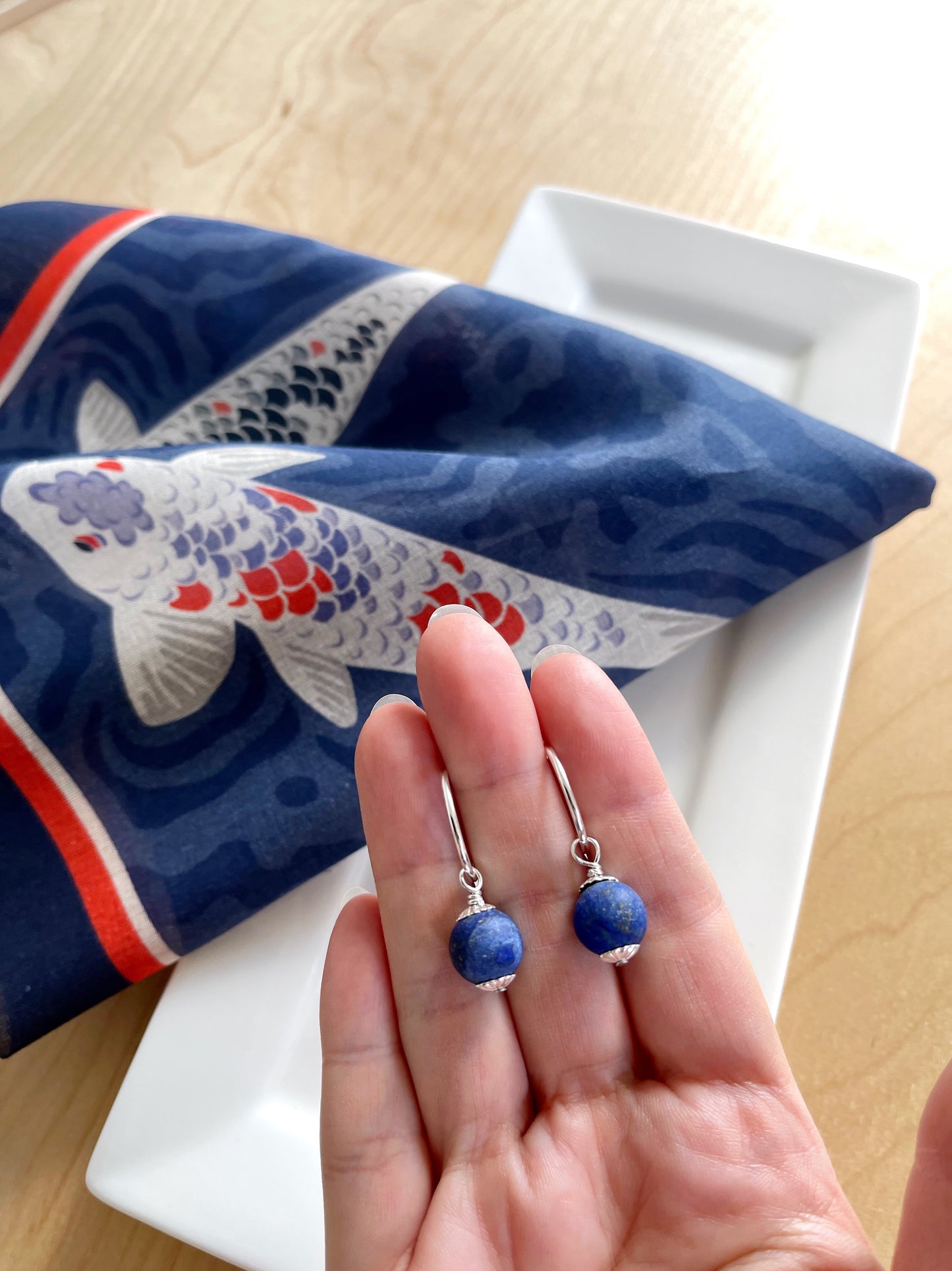 A. Lapis Lazuli dangles on sterling silver hoop earrings