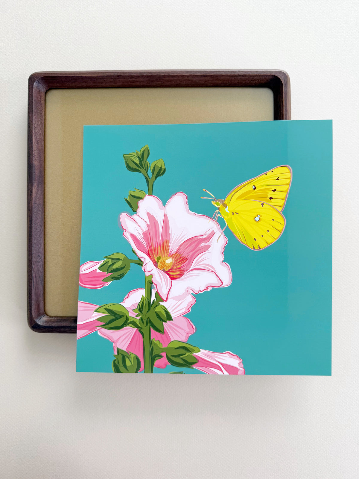 AE. Hollyhocks with a Lemon Yellow Butterfly Print