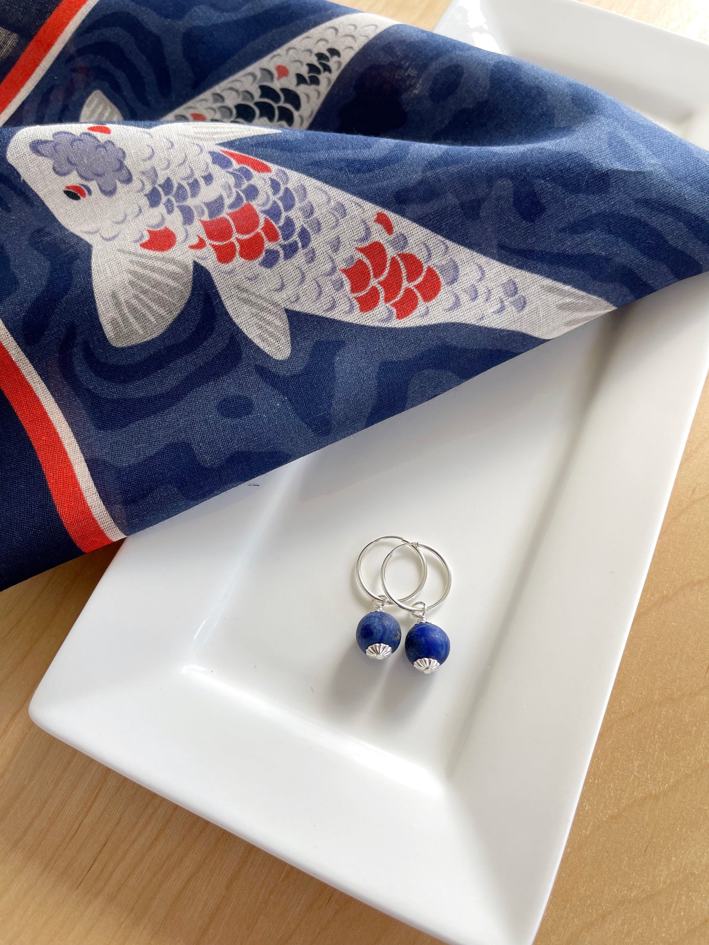 A. Lapis Lazuli dangles on sterling silver hoop earrings